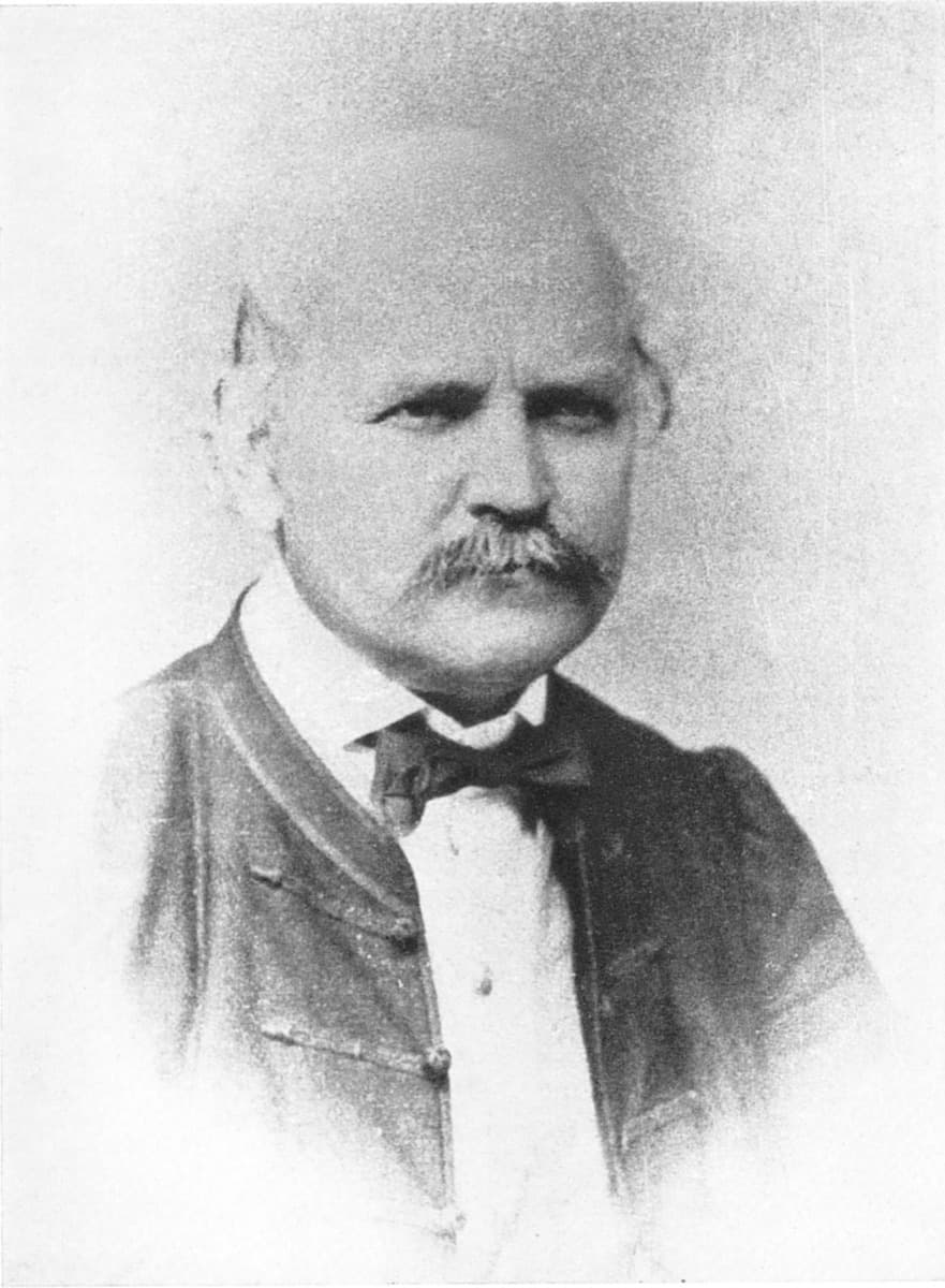 A nineteenth-century photograph of Ignaz Semmelweis, seated, in a dark coat.