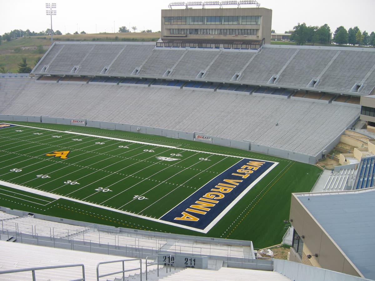 The inside of Mountaineer Field at Milan Puskar Stadium, empty, on a summer day.